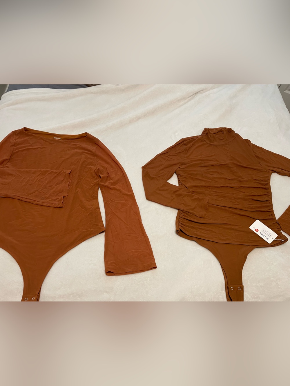Two Rust Brown Long-Sleeve One-Piece Bodysuit